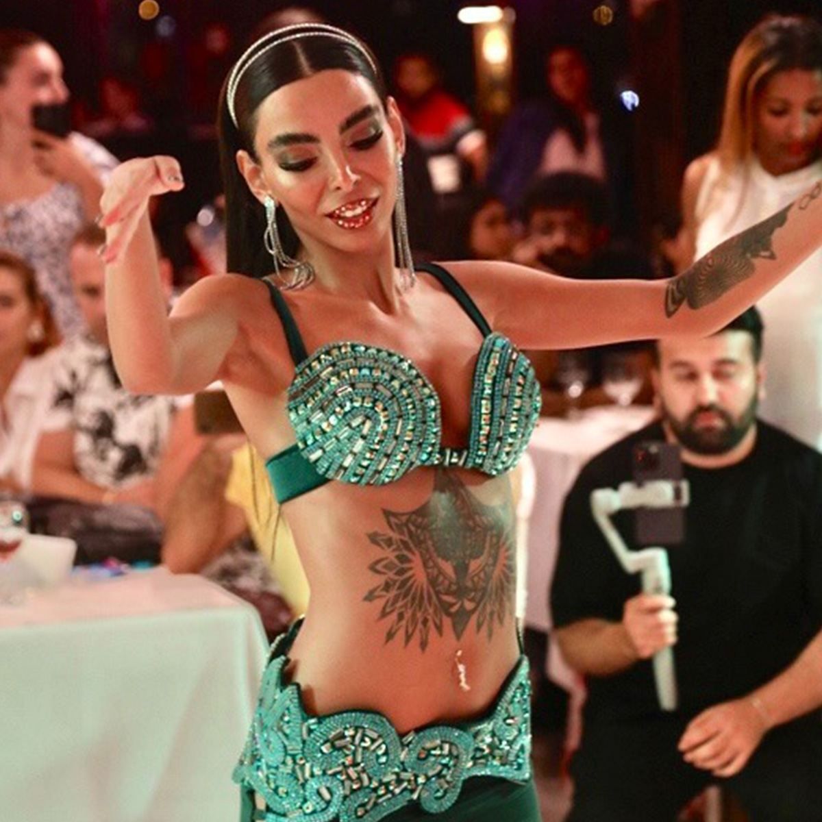 Belly dance performer entertaining guests during the show